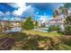 Home with a large backyard, pond, and trees at 204 Harvest Ln, Pittsboro, NC 27312