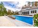 Large in-ground pool surrounded by a spacious patio at 204 Harvest Ln, Pittsboro, NC 27312