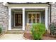 Front porch with stone accents, double doors, and a charming pumpkin display at 204 Harvest Ln, Pittsboro, NC 27312