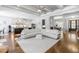 Open concept living room and kitchen with hardwood floors and large island at 204 Harvest Ln, Pittsboro, NC 27312