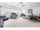 Bright bonus room with large windows, comfy seating and workspace at 204 Harvest Ln, Pittsboro, NC 27312