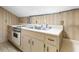 Small kitchenette with sink, countertop, and cabinets at 715 E Broad St, Fuquay Varina, NC 27526