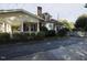 Side view of the house, highlighting the driveway and landscaping at 715 E Broad St, Fuquay Varina, NC 27526