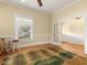 Bright living room with hardwood floors and large window at 715 E Broad St, Fuquay Varina, NC 27526