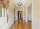 Elegant entryway with hardwood floors and chandelier at 715 E Broad St, Fuquay Varina, NC 27526