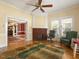 Sitting room featuring a fireplace and hardwood floors at 715 E Broad St, Fuquay Varina, NC 27526