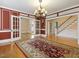 Spacious dining room with hardwood floors and chandelier at 715 E Broad St, Fuquay Varina, NC 27526