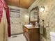 Bathroom with antique vanity and floral wallpaper at 715 E Broad St, Fuquay Varina, NC 27526