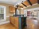 Eat-in kitchen with island and views into dining room at 715 E Broad St, Fuquay Varina, NC 27526