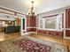 Elegant dining room with chandelier and hardwood floors at 715 E Broad St, Fuquay Varina, NC 27526