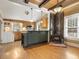 Kitchen with wood beams, wood stove, and island at 715 E Broad St, Fuquay Varina, NC 27526