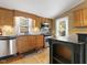Well-equipped kitchen featuring stainless steel appliances and ample cabinetry at 715 E Broad St, Fuquay Varina, NC 27526