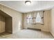 Upstairs bedroom with carpet and windows at 715 E Broad St, Fuquay Varina, NC 27526