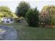Landscaped backyard with a shed and mature trees at 715 E Broad St, Fuquay Varina, NC 27526