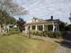 House exterior showcasing a spacious front porch and landscaping at 715 E Broad St, Fuquay Varina, NC 27526
