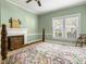 Bedroom with fireplace and floral bedding at 715 E Broad St, Fuquay Varina, NC 27526