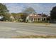 Two-story house with front porch, visible from across the road at 715 E Broad St, Fuquay Varina, NC 27526