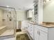 Bathroom with double vanity and walk-in shower at 715 E Broad St, Fuquay Varina, NC 27526