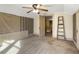 Upstairs bedroom with carpet, ceiling fan, and access to hallway at 715 E Broad St, Fuquay Varina, NC 27526