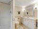 Full bathroom with shower, toilet, and double vanity at 715 E Broad St, Fuquay Varina, NC 27526