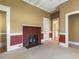 Bedroom with brick fireplace and carpet at 715 E Broad St, Fuquay Varina, NC 27526