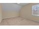 Charming bedroom featuring carpet, window with blinds, and neutral walls at 105 Lance Ln, Youngsville, NC 27596