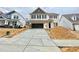 New construction home with two-car garage and freshly poured driveway at 99 Baird Cove Ln # 173, Angier, NC 27501