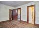 Hardwood floor bedroom with access to bathroom and kitchen at 3007 University Dr, Durham, NC 27707