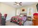 Cozy bedroom with a comfortable bed, window, and ceiling fan at 143 Rawhide Dr, Louisburg, NC 27549