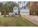 Two-story home with gray siding, deck, and attached garage at 143 Rawhide Dr, Louisburg, NC 27549