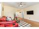 Living room with hardwood floors and a large TV at 143 Rawhide Dr, Louisburg, NC 27549