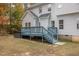Two-story house featuring a deck, hot tub, and backyard at 143 Rawhide Dr, Louisburg, NC 27549