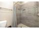 Bathroom with tiled shower and neutral color palette at 143 Rawhide Dr, Louisburg, NC 27549