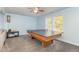 Fun game room with a ping pong table and large windows at 143 Rawhide Dr, Louisburg, NC 27549