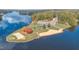 Aerial view of lakefront community with sandy beach and playground at 143 Rawhide Dr, Louisburg, NC 27549