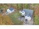 Aerial view of house, detached garage, and yard at 143 Rawhide Dr, Louisburg, NC 27549