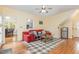 Living room features a red leather couch and a fireplace at 143 Rawhide Dr, Louisburg, NC 27549