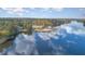 Stunning view of lake with clubhouse and beach at 143 Rawhide Dr, Louisburg, NC 27549