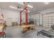 Spacious workshop with a car lift and workbench at 143 Rawhide Dr, Louisburg, NC 27549