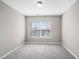 Cozy bedroom with window and neutral colored carpet at 254 Linden Park Ln Ln, Cary, NC 27519