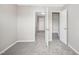 Well-lit bedroom with closet and access to the hallway at 254 Linden Park Ln Ln, Cary, NC 27519
