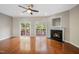 Living room with hardwood floors, fireplace, and sliding glass doors to deck at 254 Linden Park Ln Ln, Cary, NC 27519