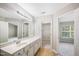 Bathroom with vanity, walk-in closet, and a bedroom view at 254 Linden Park Ln Ln, Cary, NC 27519
