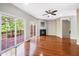 Living room with hardwood floors, fireplace, and sliding glass doors to deck at 254 Linden Park Ln Ln, Cary, NC 27519