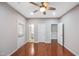 Bedroom with hardwood floors and multiple doors at 254 Linden Park Ln Ln, Cary, NC 27519