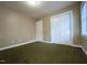 Spacious bedroom with large closet and neutral carpeting at 200 W Woodcroft Pkwy # 36A, Durham, NC 27713