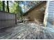 Wooden deck with bench and stairs leading down at 200 W Woodcroft Pkwy # 36A, Durham, NC 27713