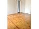 Hardwood floor bedroom with access to hallway at 325 Ranch Farm Rd # A - B, Raleigh, NC 27603
