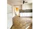 White kitchen cabinets and view into laundry room at 325 Ranch Farm Rd # A - B, Raleigh, NC 27603