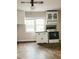 Kitchen with white cabinets, tiled floor, and double window at 325 Ranch Farm Rd # A - B, Raleigh, NC 27603